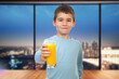 Young Boy Offers an Orange Juice