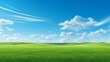 © MD Media - Green field on the horizon Panoramic green field landscape view. Blue mountains background and bright blue sky. Windows background, wallpaper