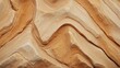 Warm-toned sandstone texture showcasing wavy patterns and sedimentary layers.