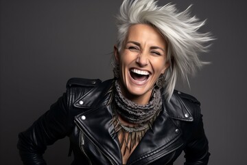 Portrait of a beautiful woman with blond hair in a leather jacket