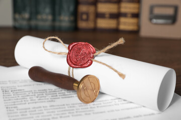 Sticker - Documents and stamp on wooden table, closeup. Notary contract