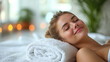 © D-Stock Photo - Beautiful young woman lying on massage table in spa salon, closeup