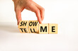© Dzmitry - Tell or show me symbol. Businessman turns beautiful wooden cubes and changes words Tell me to Show me. Beautiful white table white background. Business tell or show me concept. Copy space.