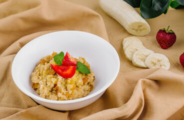 Wall Mural - oatmeal with banana on top view