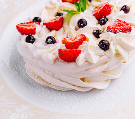 Wall Mural - Pavlova cakes with cream and fresh berries on plate