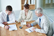 © Katie/peopleimages.com - Business people, boardroom and signature on paperwork in meeting or lawyer agreement, partnership or negotiation. Men, woman and document in corporate office for collaboration, consultant or contract