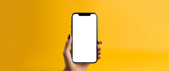Woman holding smartphone on a yellow background