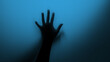 © Vladimir - Hand silhouette on blue background. Blurred human hand shape out of focus