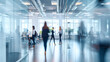 © IBEX.Media - Businesspeople walking in busy modern office background