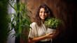 © Philippova - Woman gardener holding houseplant. Taking care about houseplants