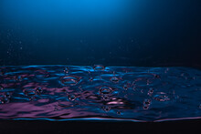 Mystical Blue Water Surface With Sparkling Droplets