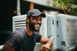 © Geber86 - Smiling young male technician working on the air control unit