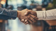 two people shaking hands for a business deal