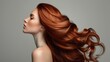 © buraratn - woman shiny long wavy hair up. side view. grey background