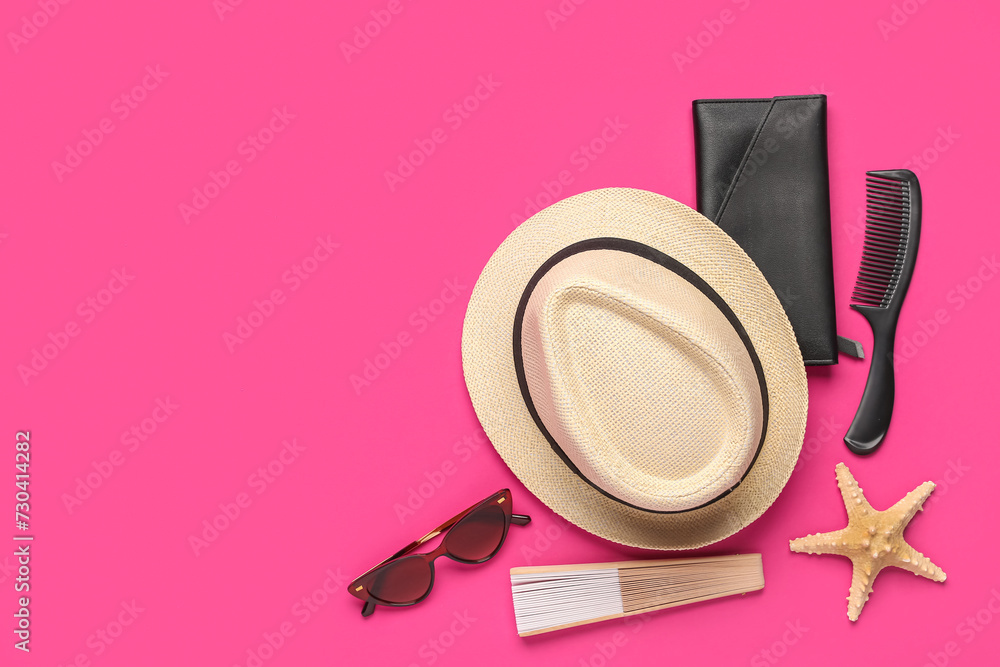 Composition with beach accessories, wallet and hair comb on color background