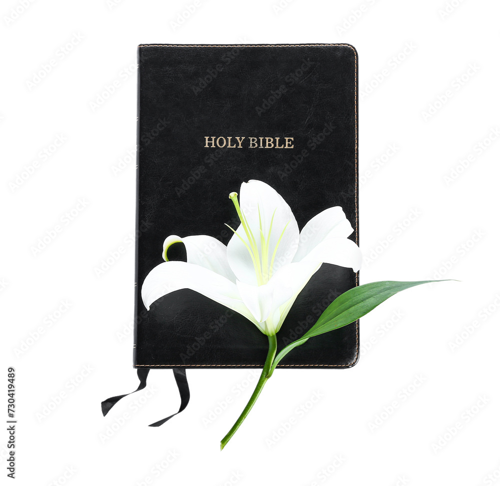 Bible with lily flower on white background