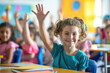 Children raise their hands to answer in the classroom. Back To School concept