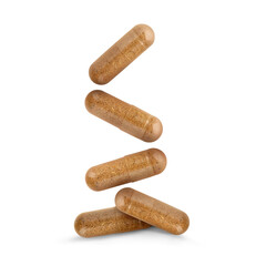 Sticker - Vitamin. Many capsules falling on white background