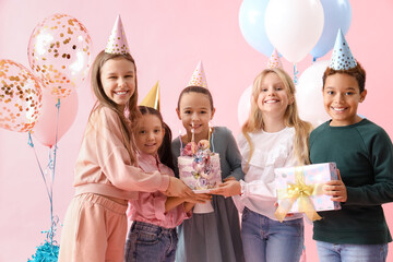 Sticker - Cute little children in party hats with Birthday cake and gift on pink background