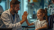 © DB Media - Friendly pediatrician giving high five to little patient in wheelchair. Cute preschool girl in wheelchair greeting doctor in hospital.