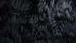 Deep black luxurious fur texture. Fur of black cat, puma, panther, fox, arctic fox, bear, wolf. Animal skin design. Concept of luxury, softness, coziness, fashion background, monochrome elegance.