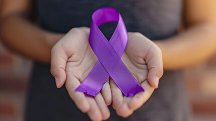 purple ribbon, breast cancer in the hands of a woman