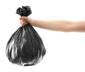 Woman holding plastic bag full of garbage on white background, closeup