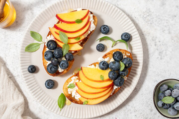 Wall Mural - Toast bread with blueberry, peach, cheese, basil leaf