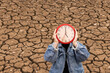 person holding watch, dry river countdown, climate change crisis, drought, drought