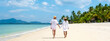 © Fokke Baarssen - Koh Mook a young couple of caucasian men and Thai Asian woman walking at the beach in Thailand