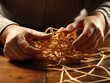A person's hand carefully untangling a complicated knot, representing the process of finding solutions.