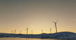 Renewable Dawn: Wind Turbines Against Winter Sunrise
