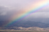 Fototapeta Tęcza - Death Valley National Park, Desert, Rare Rainbow, Rainstorm, Ground Rainbow, Atmospheric Phenomena, Unique Weather, Weather Event, Uncommon Sight, Rare Occurrence