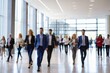 © Viewvie - Blurred image of business people walking in the lobby of a modern office building