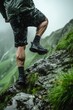A Close-up Side View of a Man Ascending a Rocky Mountain Peak, Clad in Salomon Running Gear.