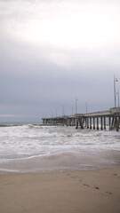 Canvas Print - pier on the beach vertical video 4k