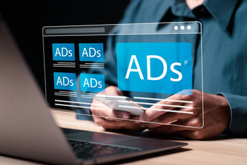Wall Mural - digital marketing and online advertising to targeted customers. person use smartphone and laptop wit