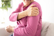 Senior woman suffers from shoulder joint pain, shoulder stiffness or osteoporosis