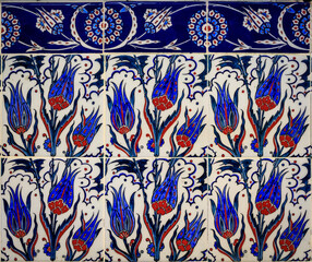 Wall Mural - Ornate blue and red handmade Turkish Iznik mosaic tiles with floral Islamic patterns in a traditional Ottoman style in Istanbul, Turkey