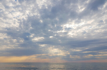 Wall Mural - pastel sunset above sea beach background. atmosphere cloudscape skyline