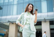 © Timeimage - Portrait of young Asian businesswoman outside the office