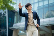 Portrait of young Asian businessman outside