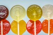 closeup of various fruitflavored lollipops in a row