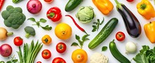 Vegetables And Fruits Elegantly Arranged On White Background Creating Vibrant Tapestry Of Healthy Organic Produce Assortment Showcases Variety And Richness Of Vegetarian And Vegan Diets