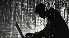 Silhouette Of A Hacker Typing On Laptop, Whole Image Is Painted With Numbers In Black And White, Like Matrix