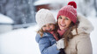 © XaMaps - Smiling mother and daughter in snowy scene