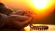 © XaMaps - A tranquil scene capturing spiritual devotion with prayer beads as the sun sets.