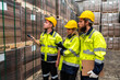 © Jack Tamrong - Warehouse worker men and woman in safety uniform checking stocks working together in distribution factory warehouse