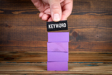 Wall Mural - Keywords Research Concept. Purple blocks on wood texture background