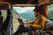© Patcharaphon - Freelance man working on computer in camper van. Road trip, motor home, work from everywhere concept